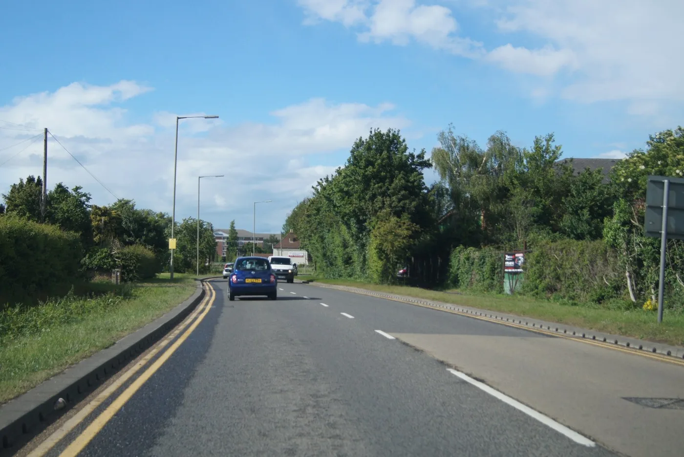 Poyle Road at Poyle Farm, Colnbrook, photographed in May 2015. The Manor Farm West site is the farmland west of Poyle Road, between Poyle Channel and Poyle Poplars